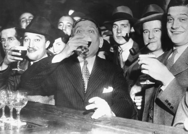 In 1933, crowds waited in anticipation for 12:01 a.m. when the Cullen-Harrison Act would officially end Prohibition in Baltimore. H. L. Mencken celebrates with a glass of Arrow Beer at the Rennert Hotel. (Frank A. Miller, Baltimore Sun file photo, 1933)