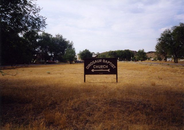 Another shot of the directional sign for Dinosaur Baptist Church, from earlier in 2011, I think. From Text of the Day.