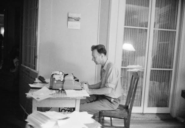 Pete Seeger at his typewriter, probably in the 1950s.