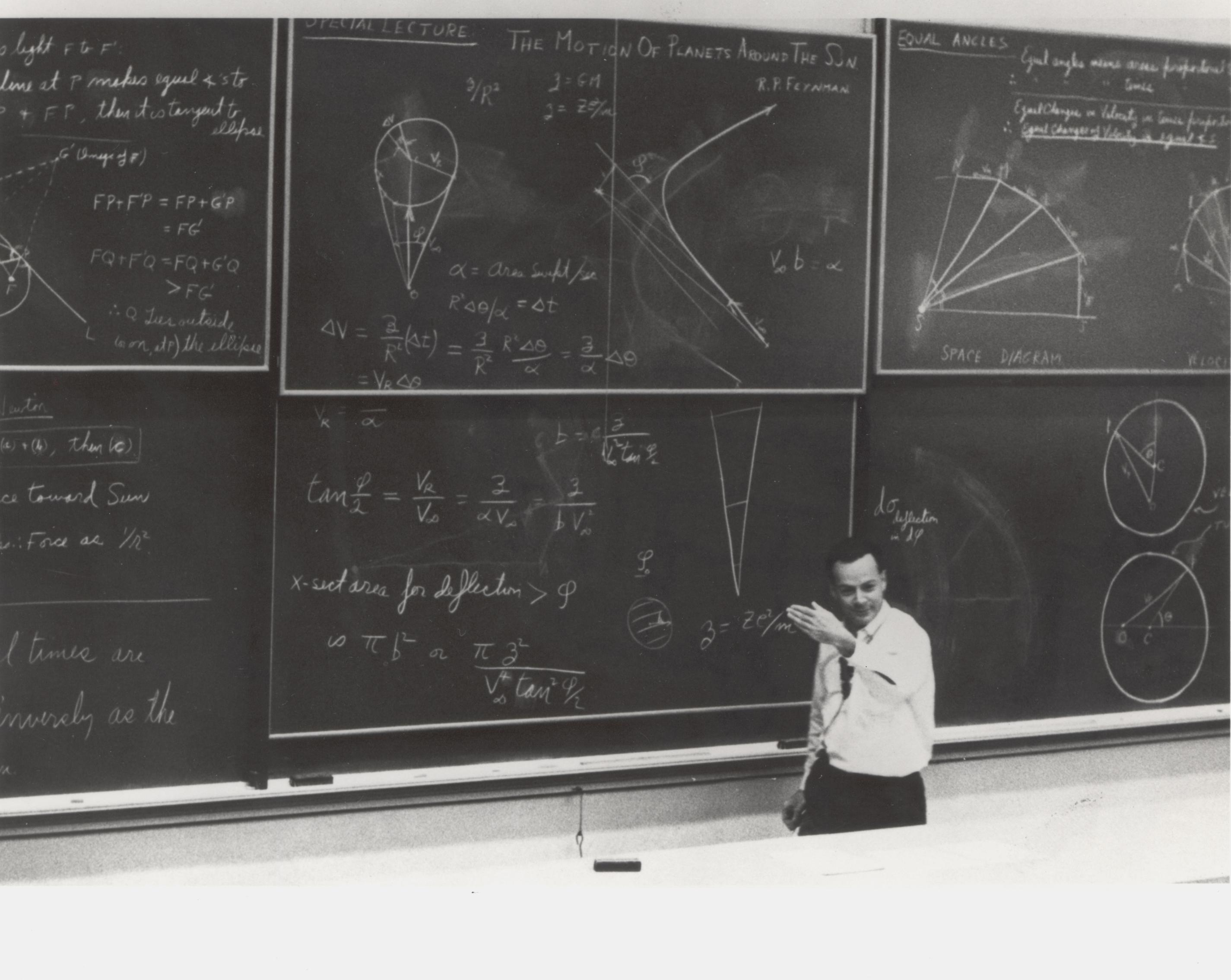 Feynman lecturing, with six chalkboards full of equations, diagrams and notes. CalTech? Feynman would have been 100 years old on May 11, 2018. This became the "lost lecture," now found.