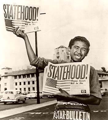 13-year-old paperboy Chester Kahapea happily hawks a commemorative edition of the Honolulu Star-Bulletin with the headline showing the state had achieved statehood after the U.S. House of Representatives passed the law authorizing Hawaii as a state. Star-Bulletin photo by Murray Befeler