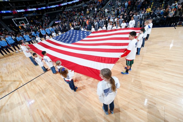 Rolling out the American flag at a Nuggets-Pacers NBA game in January 2016.